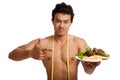 Muscular Asian man diet with clean food and measuring tape Royalty Free Stock Photo