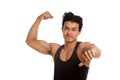 Muscular Asian man flexing biceps and thumbs down Royalty Free Stock Photo