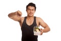 Muscular Asian man thumbs down with clean food in box Royalty Free Stock Photo