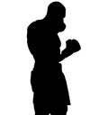 Muscular athlete, professional boxer beats a boxing jab straight punch beats volerkraft with boxing gloves. silhouette