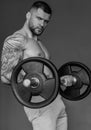 Muscular athletic fit man hard workout fitness in gym. Sport fitness and bodybuilding. Strong muscular doing exercise in Royalty Free Stock Photo