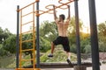 Muscular athletic man doing gymnastic exercises on the horizontal bar Royalty Free Stock Photo