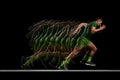 Muscular, athletic man in full motion, training, running against black background with stroboscope effect. Development