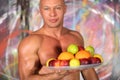 Muscular bald man with a naked torso with a plate Royalty Free Stock Photo