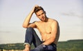 Muscular bare torso. Summer lookbook. Fitness model. Athletic handsome macho wear denim pants. Muscular body. Six packs Royalty Free Stock Photo