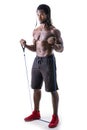 Muscular black man exercising with elastic bands Royalty Free Stock Photo