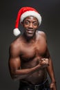 Muscular black shirtless young man in Santa Claus hat Royalty Free Stock Photo