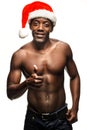 Muscular black shirtless young man in Santa Claus hat Royalty Free Stock Photo