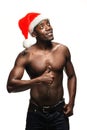 Muscular black shirtless young man in Santa Claus hat Royalty Free Stock Photo