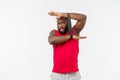 Muscular black young man exercising with elastic bands in studio, isolated on white. Royalty Free Stock Photo