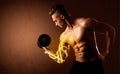 Muscular body builder lifting weight with energy lights on bicep Royalty Free Stock Photo