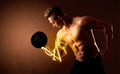 Muscular body builder lifting weight with energy lights on bicep