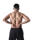 Muscular body sport man holding sore low back waist massaging with his hand suffering pain Royalty Free Stock Photo