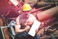 Muscular Bodybuilder Flexing Muscles in Industrial Junk Yard Royalty Free Stock Photo