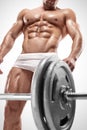 Muscular bodybuilder guy doing exercises with big dumbbell Royalty Free Stock Photo