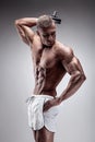 Muscular bodybuilder guy doing exercises with dumbbell Royalty Free Stock Photo