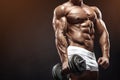 Muscular bodybuilder guy doing exercises with dumbbell Royalty Free Stock Photo