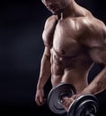 Muscular bodybuilder guy doing exercises Royalty Free Stock Photo