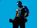 Muscular bodybuilder guy doing exercises with dumbbells isolated on blue neon. Fitness man. Handsome young muscular Royalty Free Stock Photo