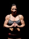 Muscular bodybuilder woman showing her muscles. Royalty Free Stock Photo
