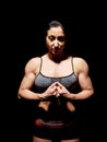 Muscular bodybuilder woman showing her muscles. Royalty Free Stock Photo