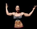 Muscular bodybuilder woman showing her muscles. Royalty Free Stock Photo