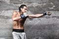 Muscular boxer man punching Royalty Free Stock Photo