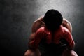 Muscular boxer resting on wall backgrounds