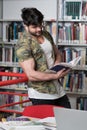 Muscular College Student in a Library Royalty Free Stock Photo