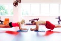 Muscular couple doing planking exercises Royalty Free Stock Photo