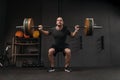 Sporty man doing back squats with barbell Royalty Free Stock Photo