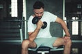 Muscular exercises dumbbell bodybuilder in fitness gym of sportsman., Portrait of caucasian handsome man doing weightlifting and Royalty Free Stock Photo