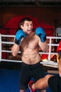 Muscular fighter with an angry face on a ring. Royalty Free Stock Photo