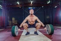 Muscular fitness man preparing to deadlift a barbell over his head in modern fitness center.Functional training.Snatch Royalty Free Stock Photo