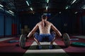 Muscular fitness man preparing to deadlift a barbell over his head in modern fitness center.Functional training.Snatch Royalty Free Stock Photo