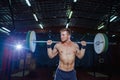 Muscular fitness man preparing to deadlift a barbell over his head in modern fitness center.Functional training.Snatch Royalty Free Stock Photo