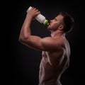 Muscular guy drinking water after training Royalty Free Stock Photo