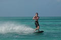 Muscular Guy Riding on a Wakeboard in Aruba Royalty Free Stock Photo