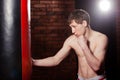 Muscular handsome fighter giving a forceful Royalty Free Stock Photo