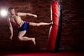 Muscular handsome fighter giving a forceful Royalty Free Stock Photo