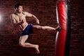 Muscular handsome fighter giving a forceful Royalty Free Stock Photo