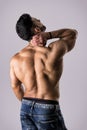 Muscular handsome man holding his neck in pain Royalty Free Stock Photo