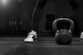 Muscular male adult exercising with kettle bell Royalty Free Stock Photo