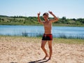 Muscular male body builder torso on a sunny day at the beach Royalty Free Stock Photo