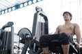 Muscular male having pain on shoulder in gym. young man injure