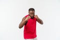 Muscular man of African descent isolated over a white background showing a closeup of his fists and knuckles. Shallow