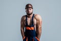 Muscular man architect with strong body. guy wear worker uniform. athletic builder in helmet. sexy man with body muscles Royalty Free Stock Photo