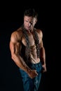 Muscular man with chain on sexy body. man with sexy bare torso in jeans. Athlete with sexy bare torso in jeans Royalty Free Stock Photo