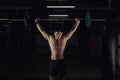 Muscular man at a crossfit gym lifting a barbell. Royalty Free Stock Photo