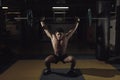 Muscular man at a crossfit gym lifting a barbell. Royalty Free Stock Photo